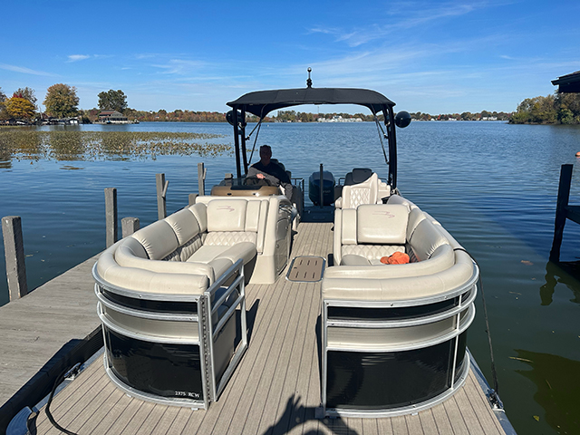 pontoon boat at dock ready for passengers